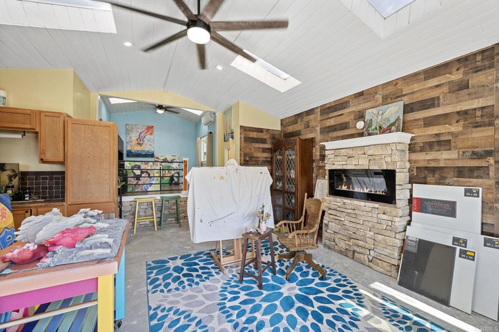 2042 Pheasant Run Road Fallbrook, CA 92028 - Photo 55 of 75 a living room with furniture and a fireplace
