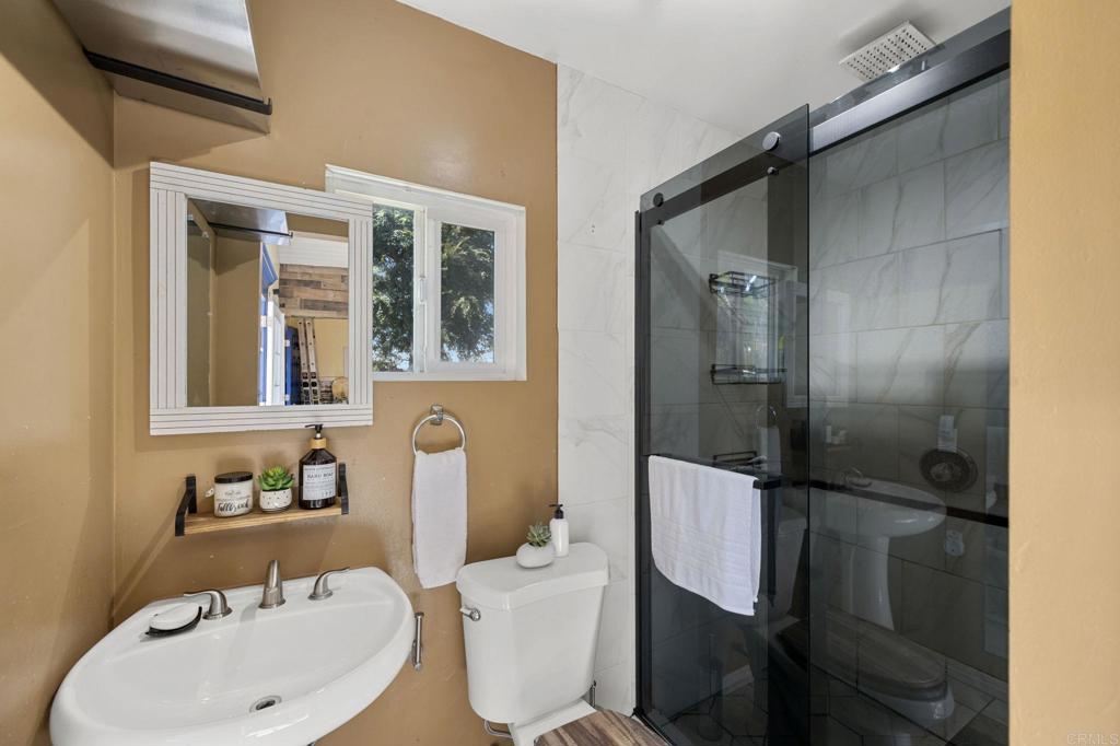 2042 Pheasant Run Road Fallbrook, CA 92028 - Photo 57 of 75 a bathroom with a sink toilet and shower