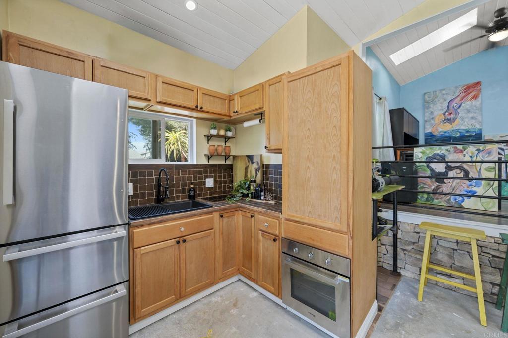 2042 Pheasant Run Road Fallbrook, CA 92028 - Photo 58 of 75 a kitchen with stainless steel appliances a refrigerator and a stove