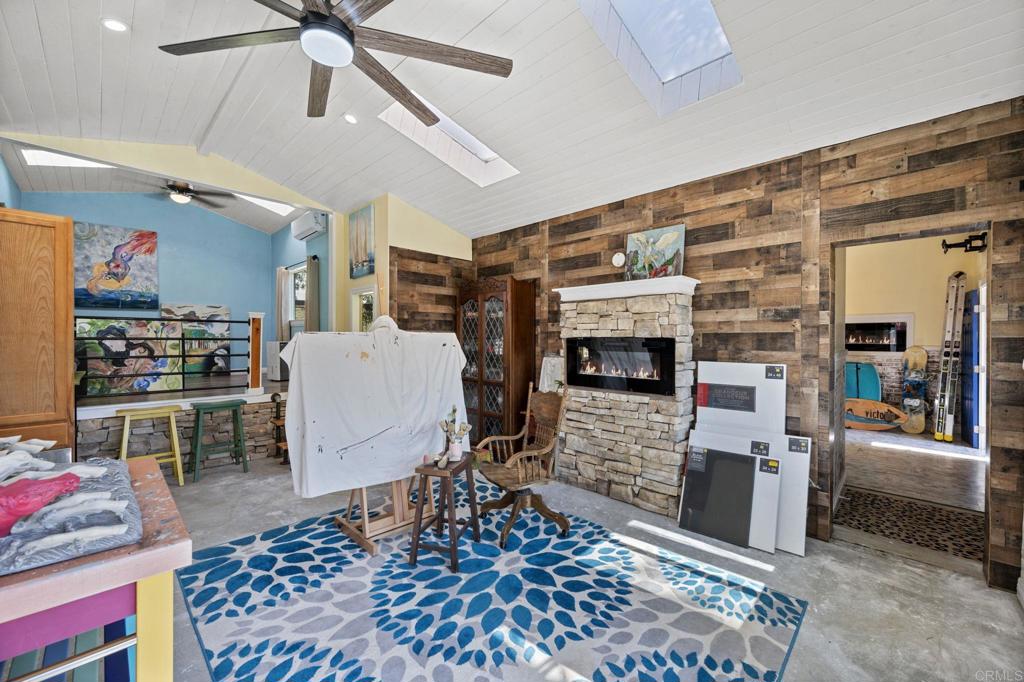 2042 Pheasant Run Road Fallbrook, CA 92028 - Photo 60 of 75 a living room with furniture and a fireplace