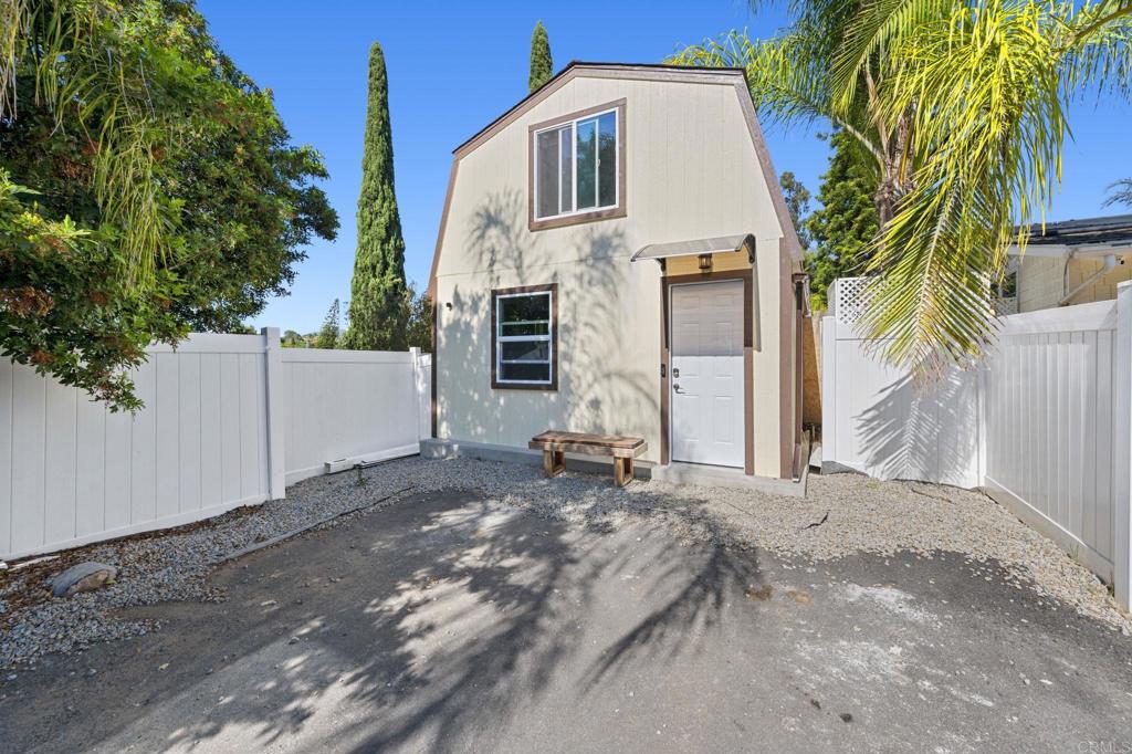 2042 Pheasant Run Road Fallbrook, CA 92028 - Photo 66 of 75 a backyard of a house with potted plants and palm trees