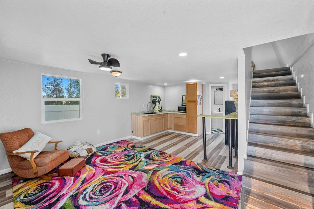 2042 Pheasant Run Road Fallbrook, CA 92028 - Photo 67 of 75 a bedroom with furniture and a wooden floor