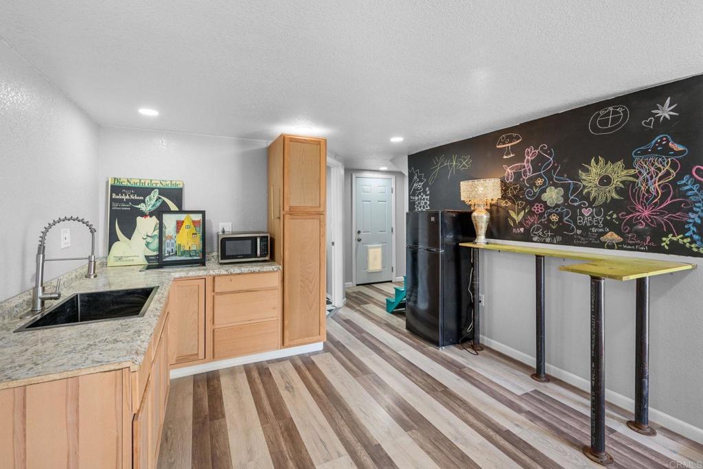 2042 Pheasant Run Road Fallbrook, CA 92028 - Photo 68 of 75 a kitchen with stainless steel appliances a refrigerator and a stove top oven