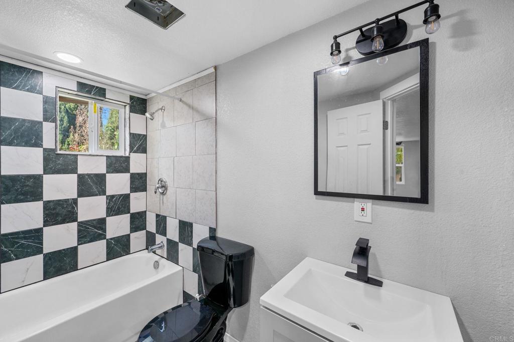 2042 Pheasant Run Road Fallbrook, CA 92028 - Photo 69 of 75 a bathroom with a sink a toilet and shower