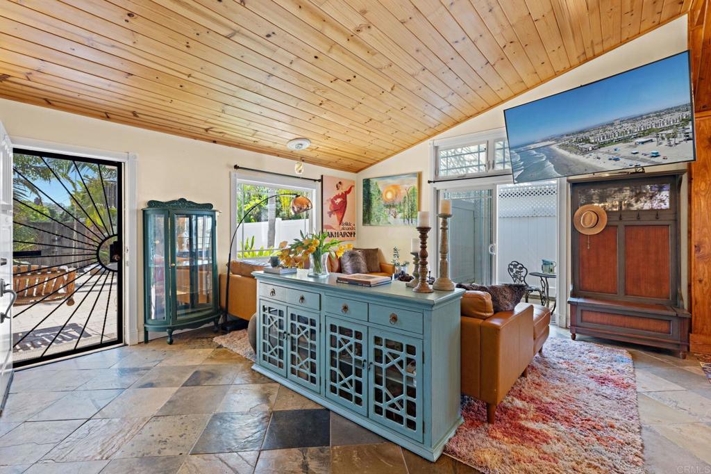 2042 Pheasant Run Road Fallbrook, CA 92028 - Photo 8 of 75 a room with lots of wooden furniture and large windows