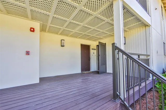a view of a room with wooden floor and windows