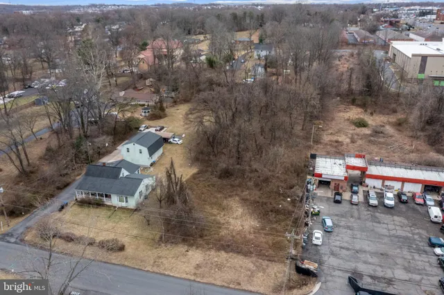 an aerial view of a house with outdoor space