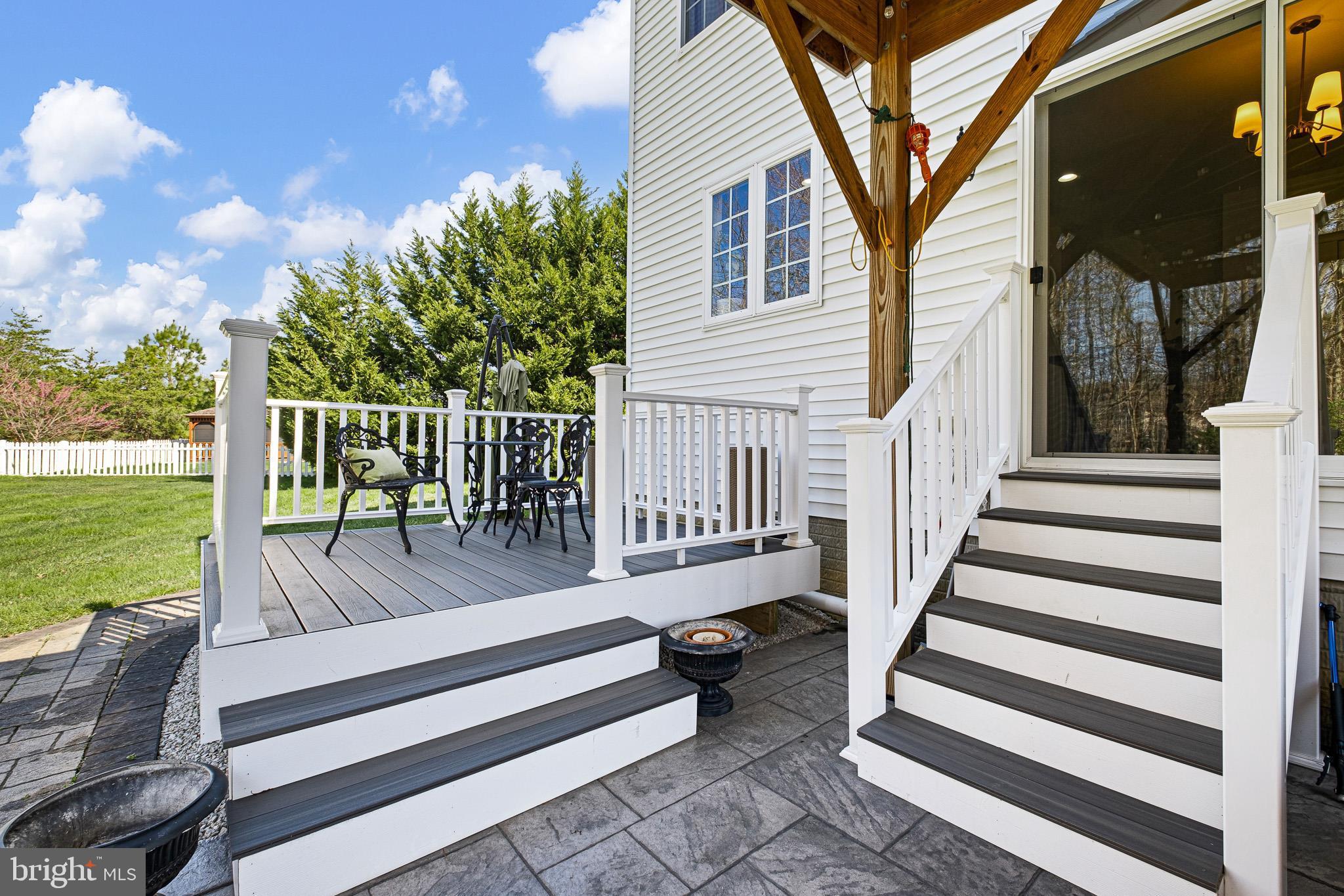 332 Watchgate Way Townsend, DE 19734 - Photo 47 of 50 a view of a balcony with wooden floor and outdoor seating
