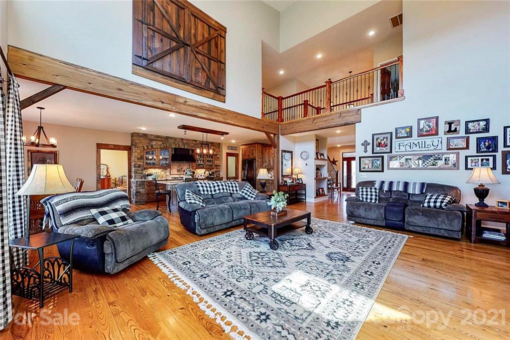 7555 Stokes Ferry Road Salisbury, NC 28146 - Photo 12 of 48 a living room with furniture rug and wooden floor