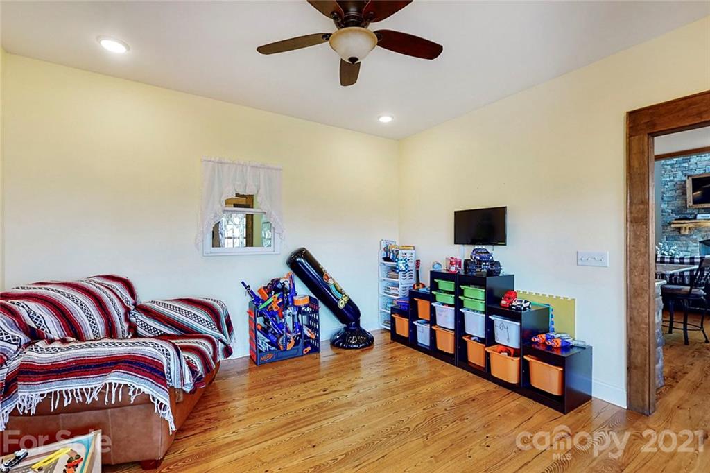 7555 Stokes Ferry Road Salisbury, NC 28146 - Photo 18 of 48 a living room with furniture and flat screen tv