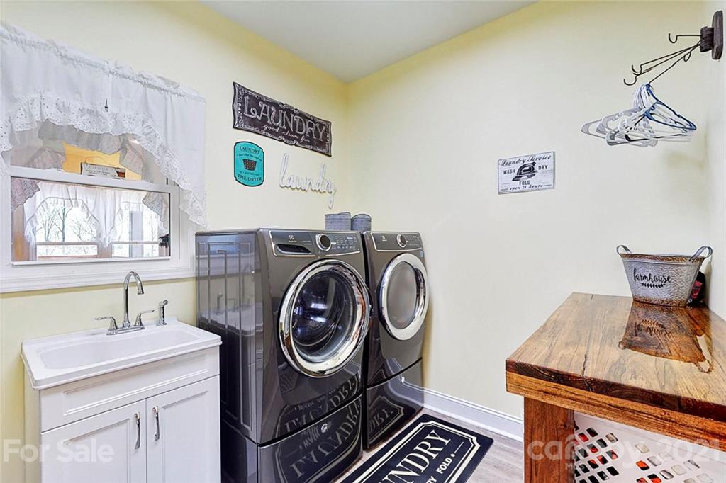 7555 Stokes Ferry Road Salisbury, NC 28146 - Photo 24 of 48 a utility room with dryer and washer