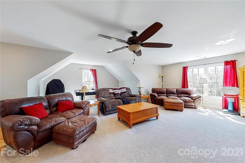 7555 Stokes Ferry Road Salisbury, NC 28146 - Photo 29 of 48 a living room with furniture and a large window