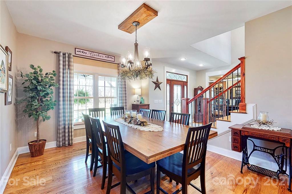 7555 Stokes Ferry Road Salisbury, NC 28146 - Photo 4 of 48 a view of a dining room with furniture window and wooden floor