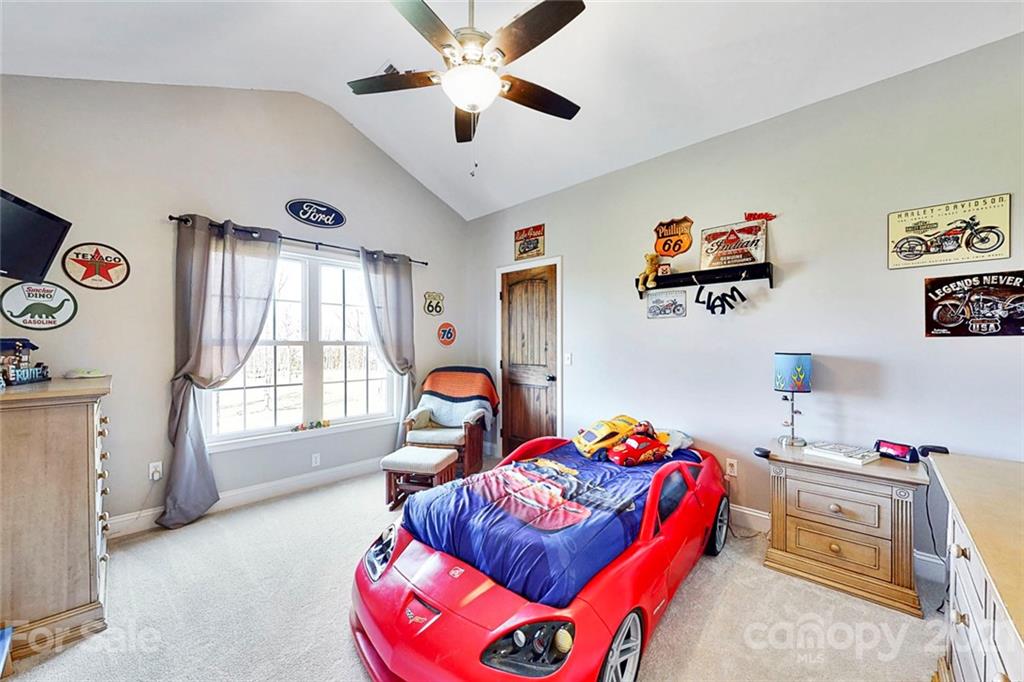 7555 Stokes Ferry Road Salisbury, NC 28146 - Photo 33 of 48 a bedroom with furniture and a large window