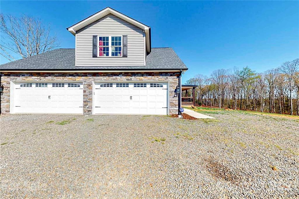 7555 Stokes Ferry Road Salisbury, NC 28146 - Photo 42 of 48 a front view of a house with a yard