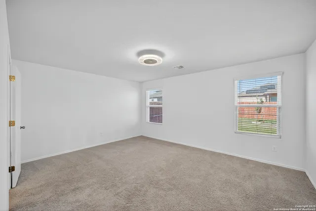 an empty room with windows