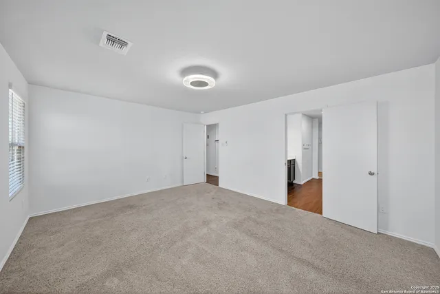 a view of an empty room and window