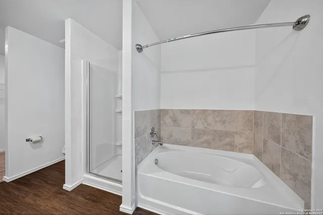 a white bath tub and shower