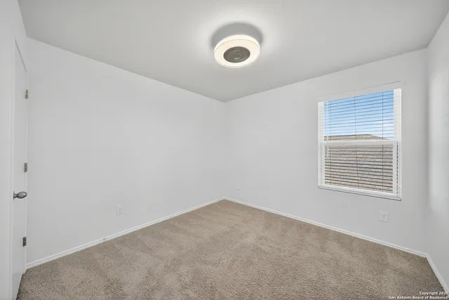 a view of empty room with windows