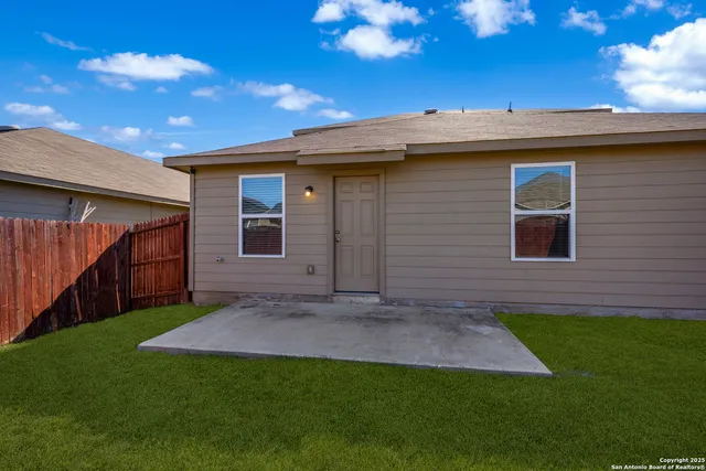a view of front of house with a yard