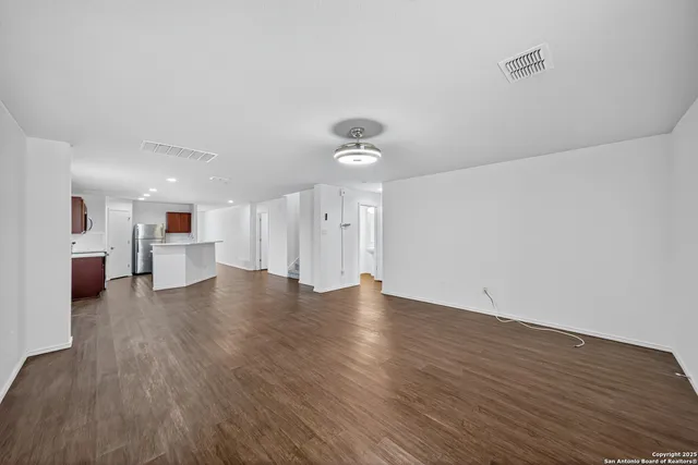 a view of a kitchen with a sink and a microwave
