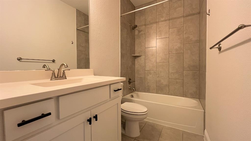 5304 Babcock Road McKinney, TX 75071 - Photo 23 of 27 a bathroom with a sink a toilet and shower