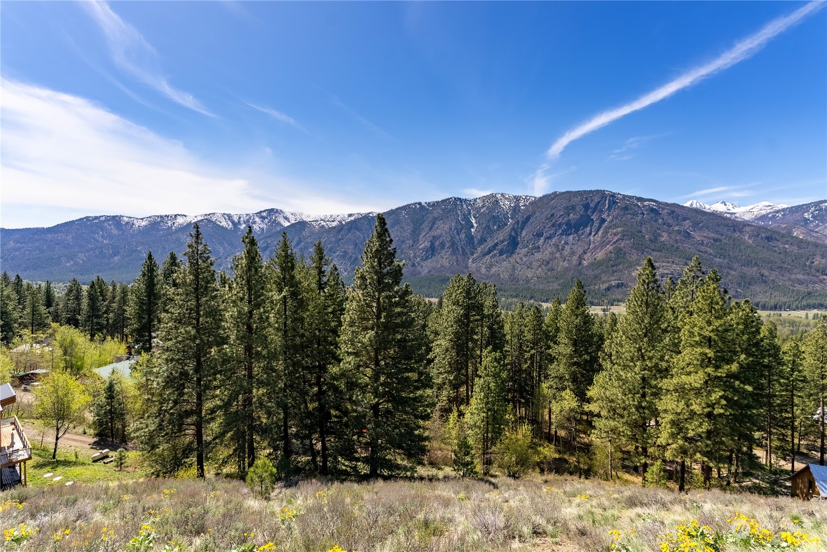 14 Trillium Road Winthrop, WA 98862 - Photo 13 of 18 a view of a top of a house with a mountain in the background