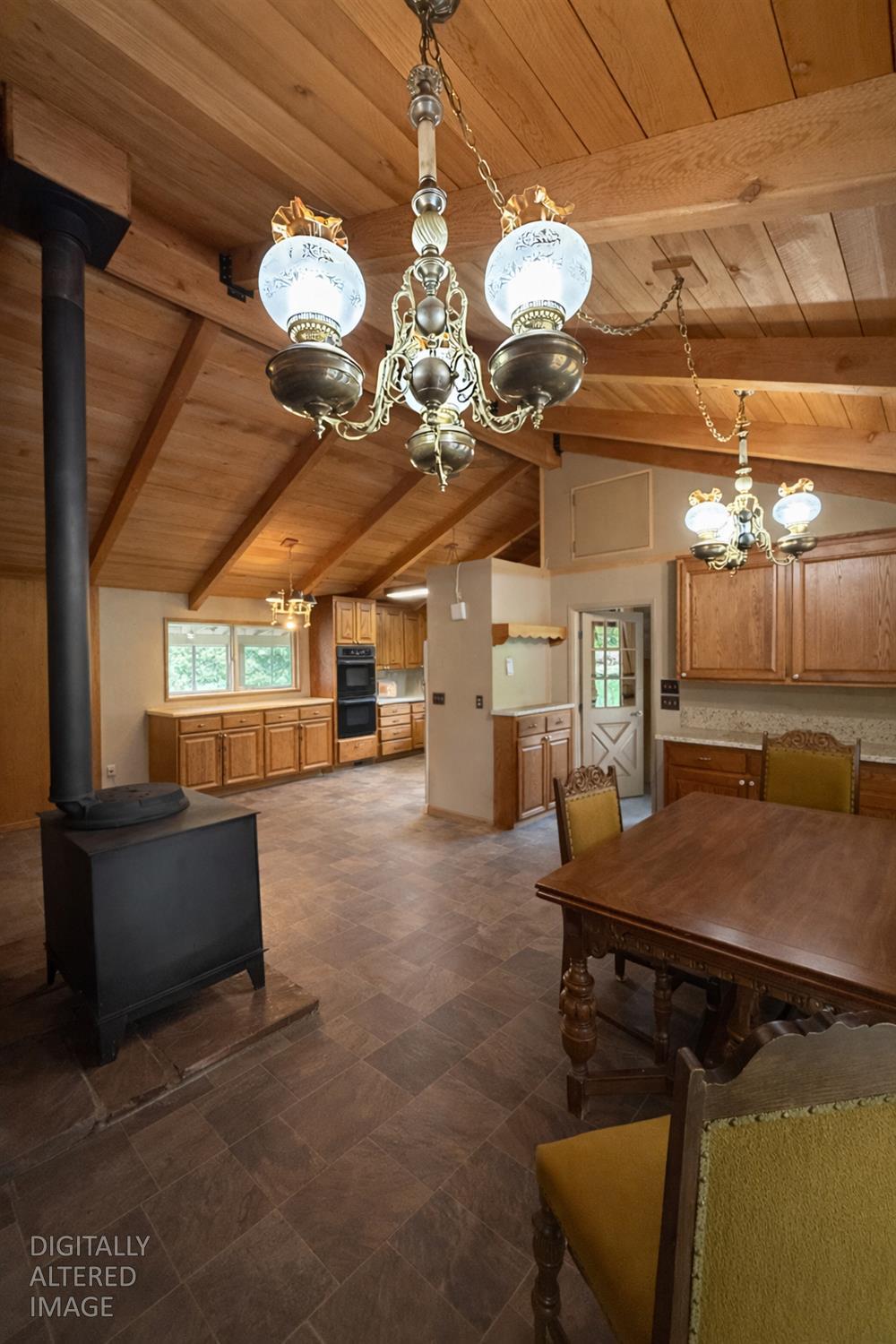 7300 Highway 193 Georgetown, CA 95634 - Photo 13 of 16 a view of a room with a chandelier and fireplace