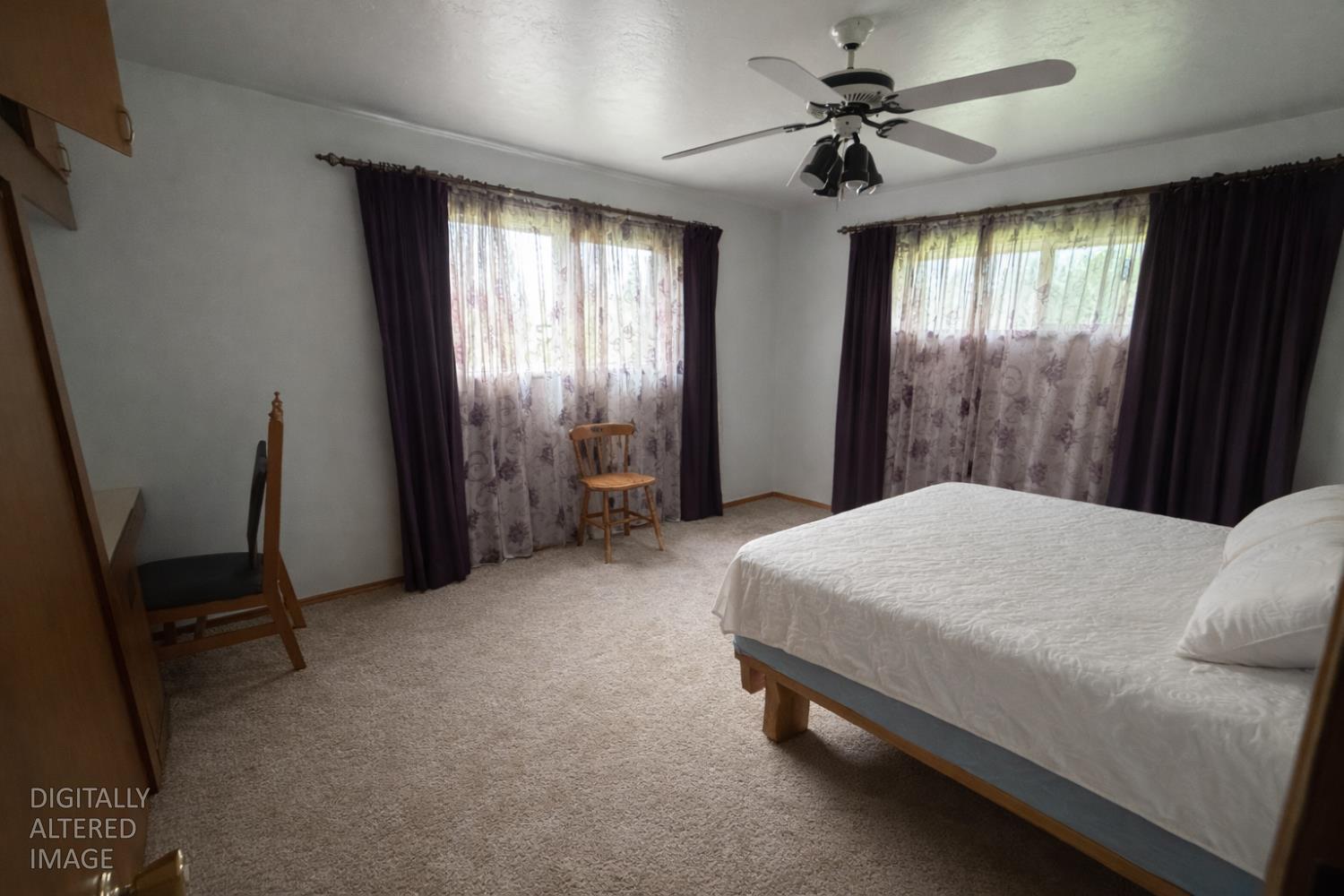 7300 Highway 193 Georgetown, CA 95634 - Photo 7 of 16 a bed sitting in a spacious bedroom next to a window
