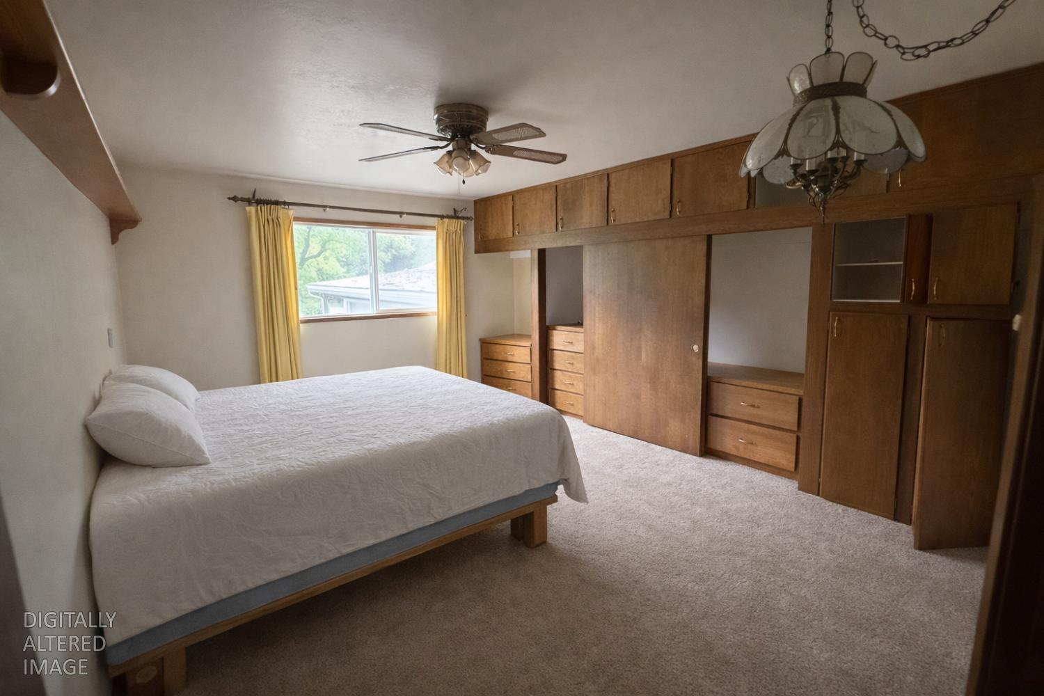 7300 Highway 193 Georgetown, CA 95634 - Photo 9 of 16 a bedroom with a bed and a chandelier