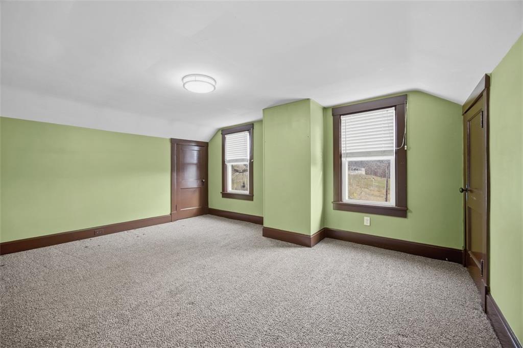 26 Covered Bridge Road Burgettstown, PA 15021 - Photo 15 of 49 an empty room with a window and a chair