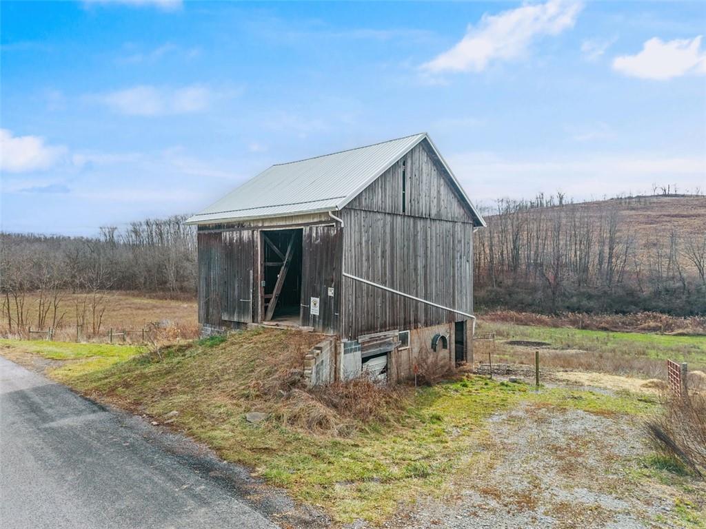 26 Covered Bridge Road Burgettstown, PA 15021 - Photo 22 of 49 a view of backyard with small cabin