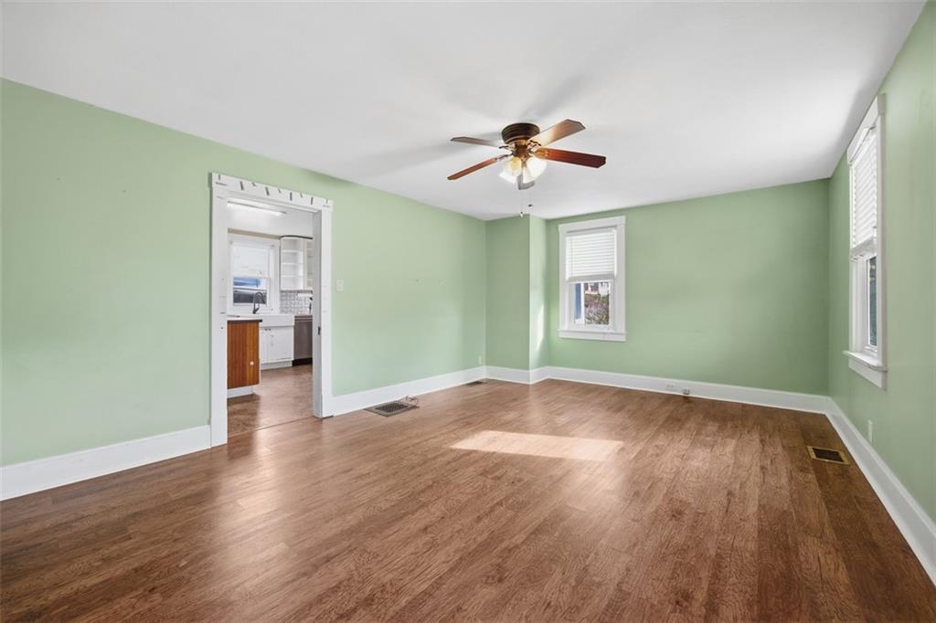26 Covered Bridge Road Burgettstown, PA 15021 - Photo 4 of 49 a view of empty room with wooden floor and fan