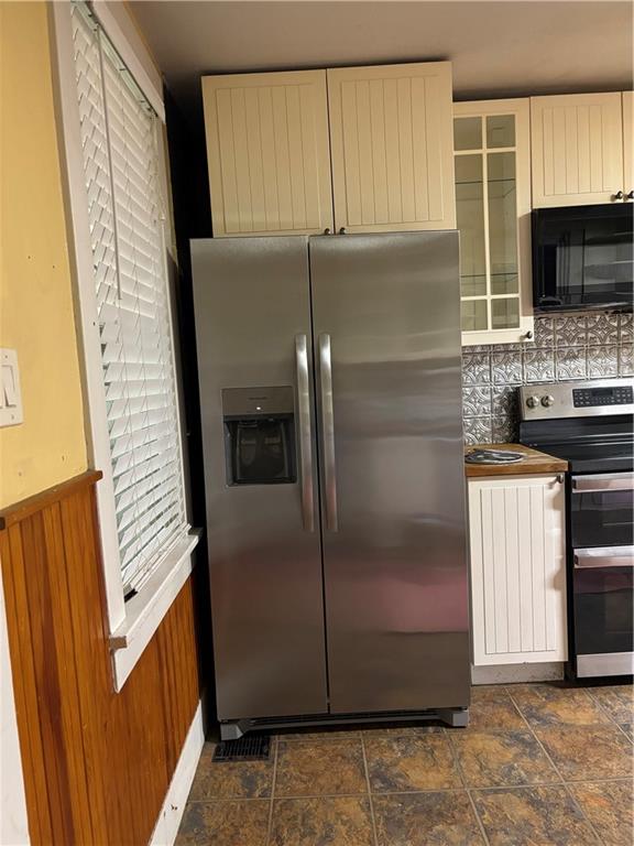 26 Covered Bridge Road Burgettstown, PA 15021 - Photo 7 of 49 a kitchen with a refrigerator and a stove