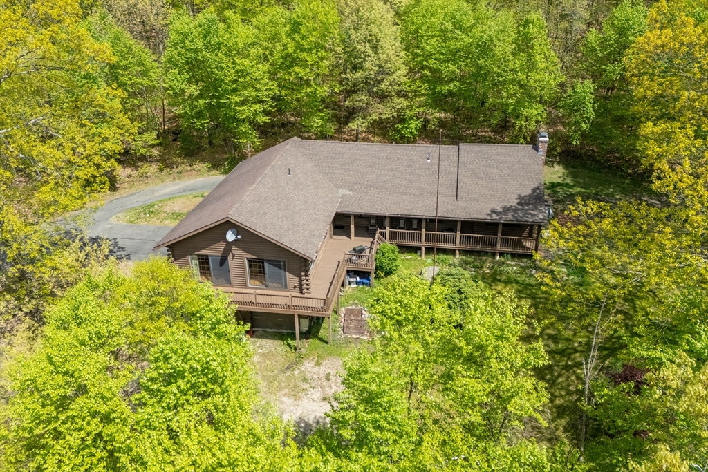 470 Mountain Road Wilbraham, MA 01095 - Photo 1 of 42 an aerial view of a house with swimming pool and garden