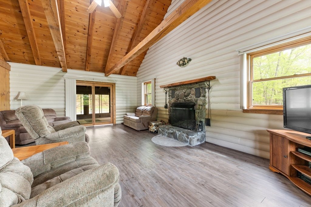 470 Mountain Road Wilbraham, MA 01095 - Photo 13 of 42 a living room with furniture a fireplace and wooden floor