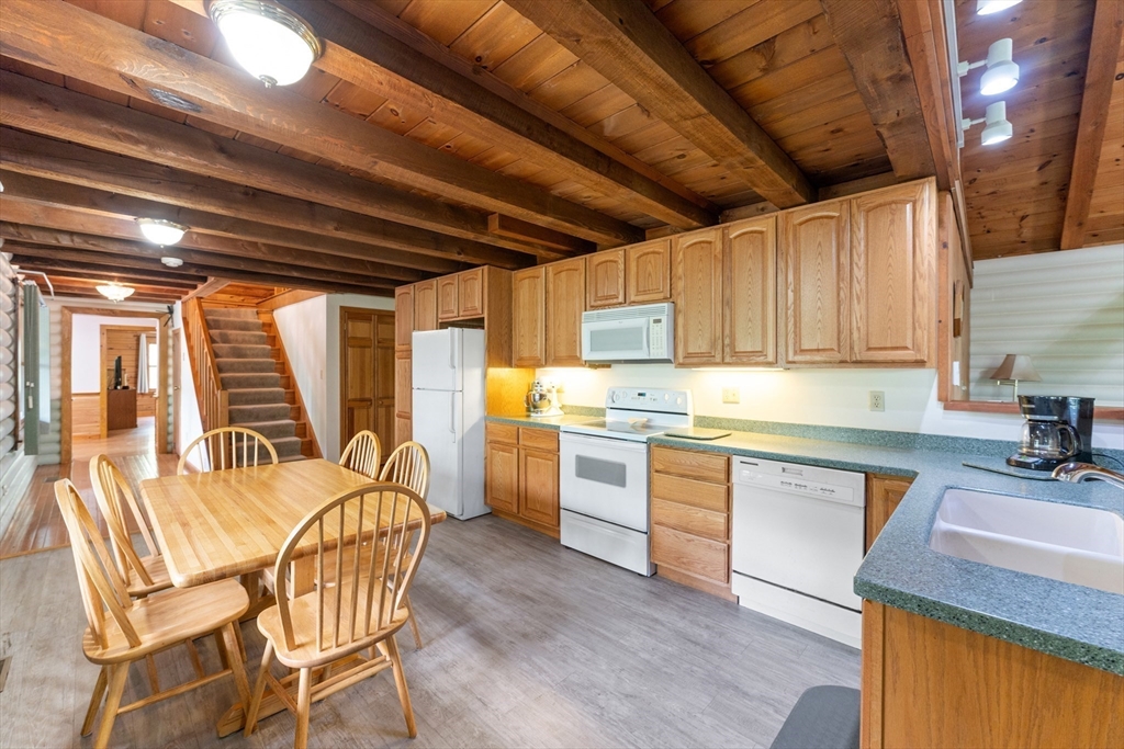 470 Mountain Road Wilbraham, MA 01095 - Photo 18 of 42 a kitchen with table chairs sink and cabinets