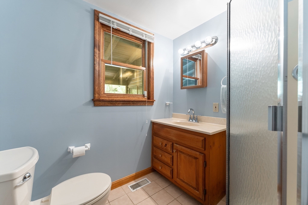 470 Mountain Road Wilbraham, MA 01095 - Photo 22 of 42 a bathroom with a toilet sink and mirror