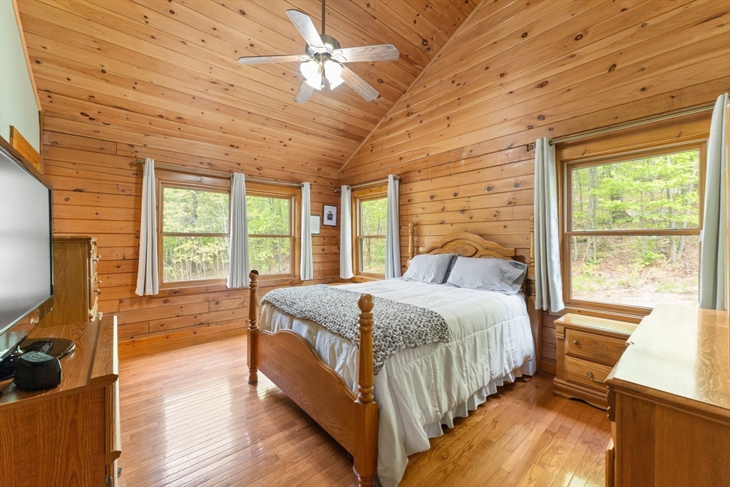 470 Mountain Road Wilbraham, MA 01095 - Photo 25 of 42 a bed sitting in a spacious bedroom next to a window