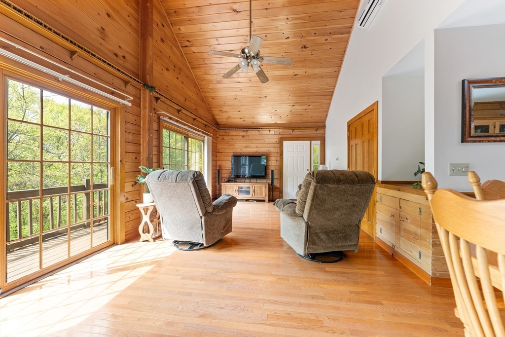 470 Mountain Road Wilbraham, MA 01095 - Photo 33 of 42 a living room with furniture and a flat screen tv