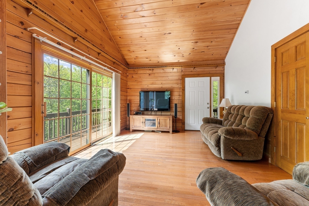 470 Mountain Road Wilbraham, MA 01095 - Photo 34 of 42 a living room with furniture and a flat screen tv