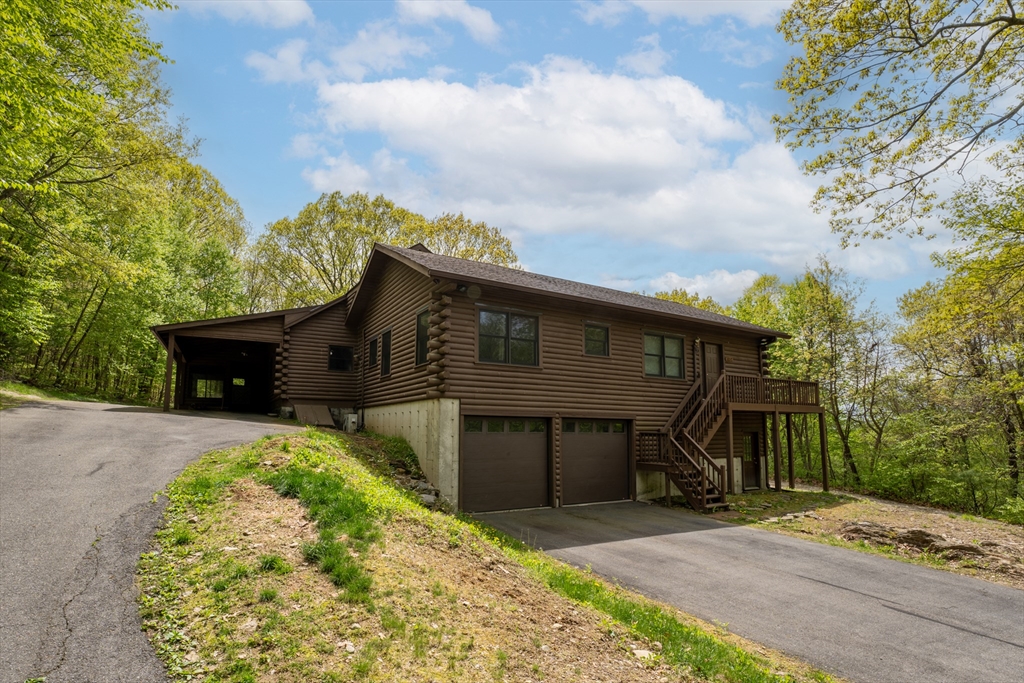 470 Mountain Road Wilbraham, MA 01095 - Photo 4 of 42 a front view of a house with a garden