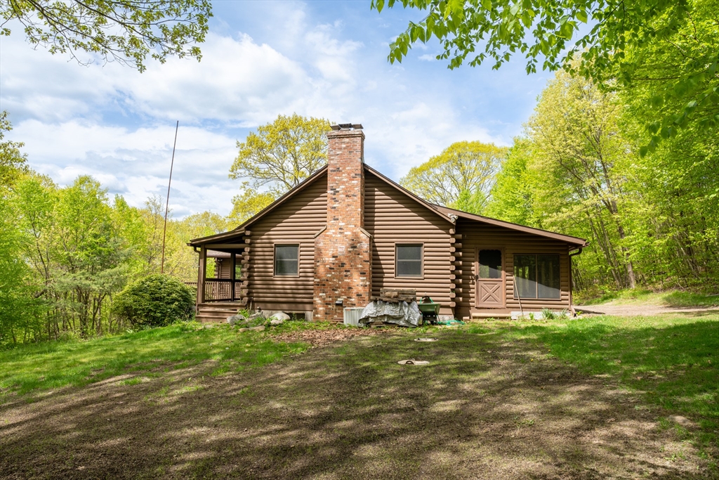 470 Mountain Road Wilbraham, MA 01095 - Photo 7 of 42 a view of a backyard with plants and large trees