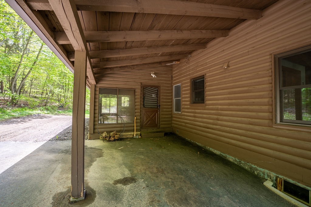 470 Mountain Road Wilbraham, MA 01095 - Photo 8 of 42 a view of a porch with a table and chairs