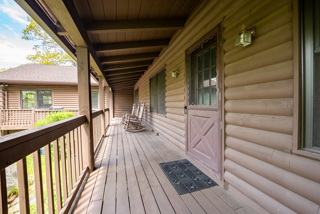 470 Mountain Road Wilbraham, MA 01095 - Photo 9 of 42 a view of a balcony with furniture and wooden floor