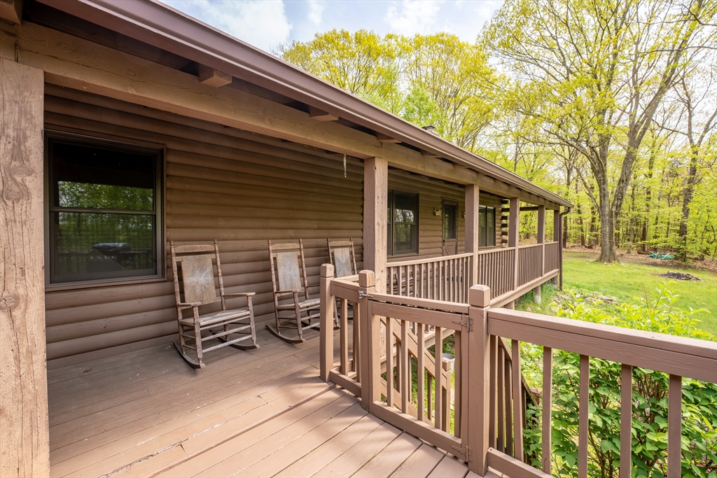 470 Mountain Road Wilbraham, MA 01095 - Photo 10 of 42 a view of a chair and tables in the balcony