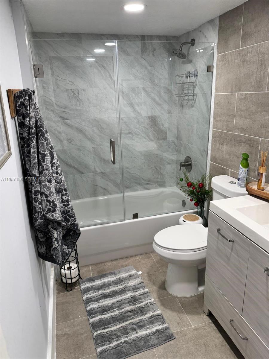 2931 Southeast 12th Road, Unit 10555 Homestead, FL 33035 - Photo 12 of 21 a bathroom with a toilet and a shower