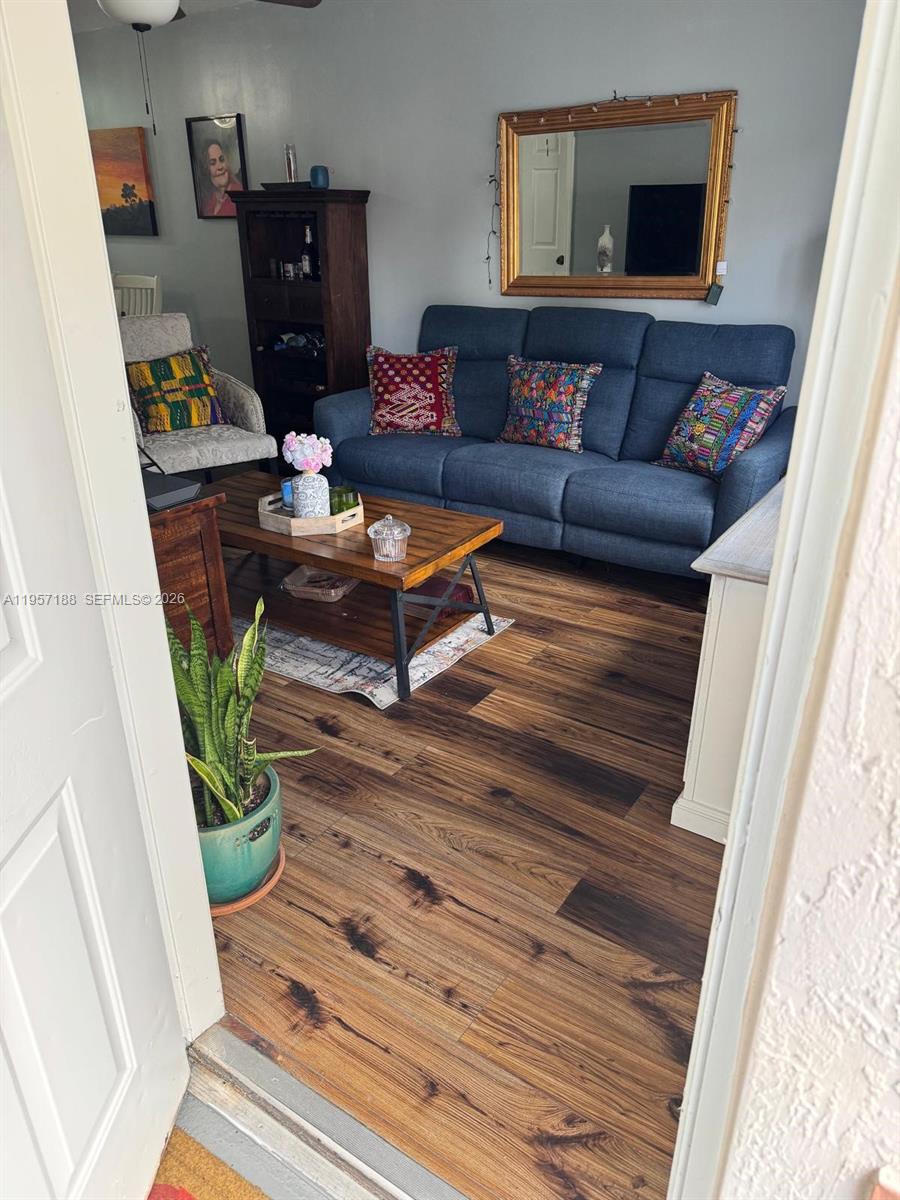 2931 Southeast 12th Road, Unit 10555 Homestead, FL 33035 - Photo 2 of 21 a living room with furniture and a potted plant