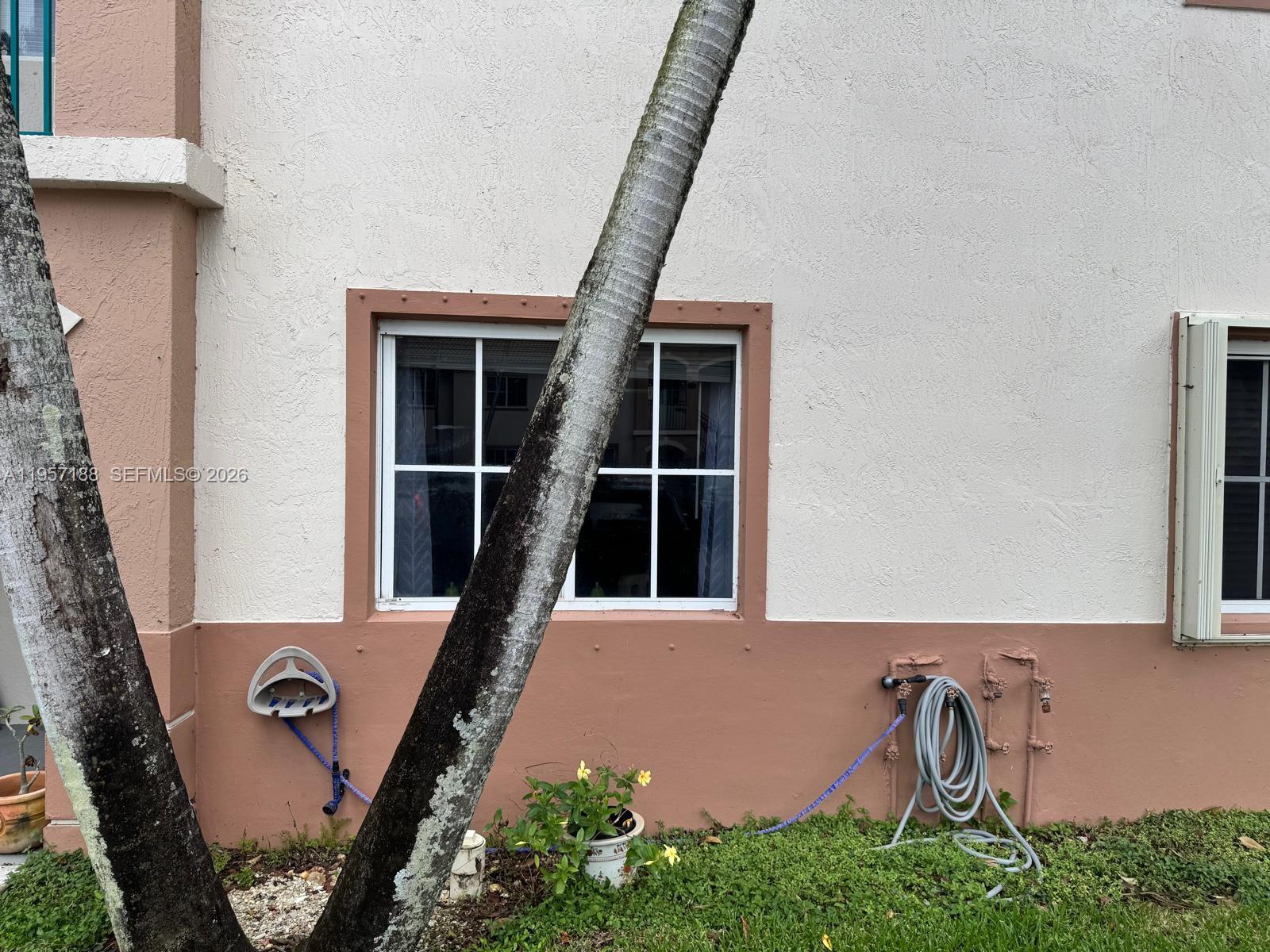 2931 Southeast 12th Road, Unit 10555 Homestead, FL 33035 - Photo 21 of 21 a front view of a house with barbeque grill