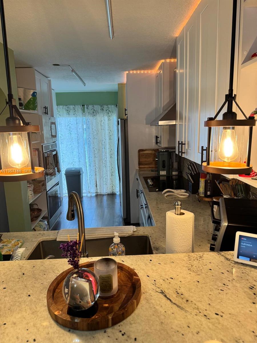 2931 Southeast 12th Road, Unit 10555 Homestead, FL 33035 - Photo 4 of 21 a bathroom with a sink and a mirror